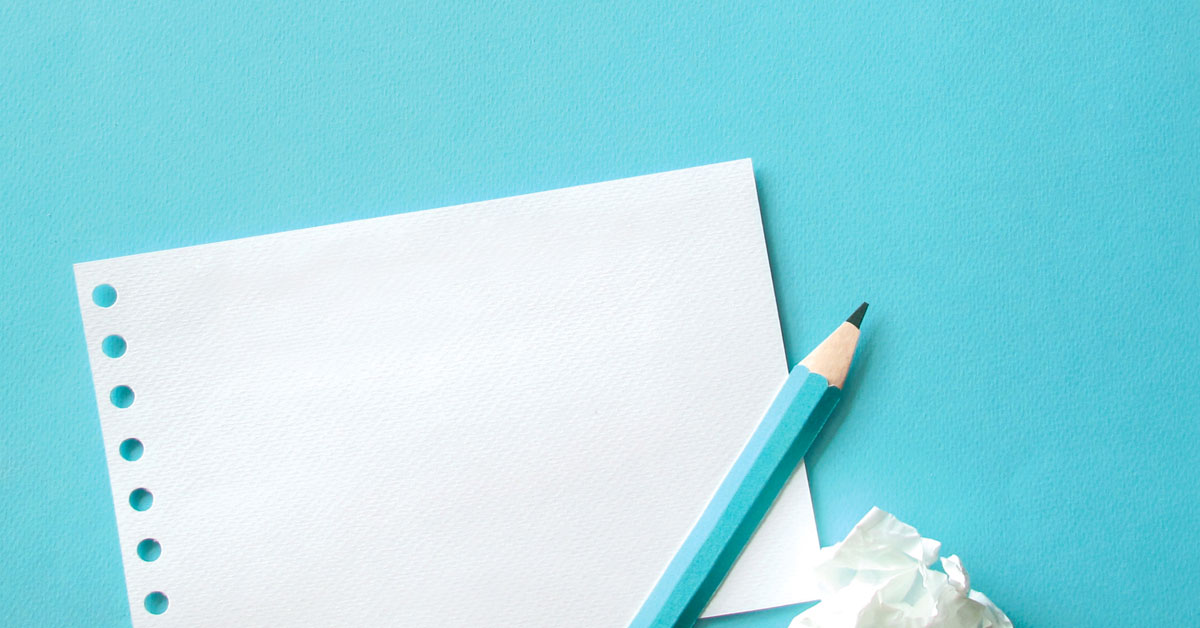 picture of pencil and paper on a turquoise background